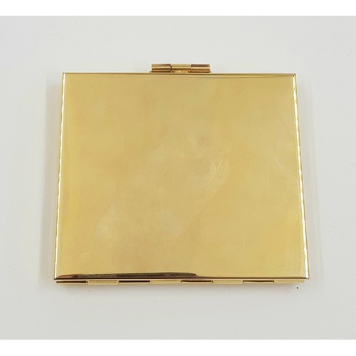 887 - A gold and silver effect metal vanity mirror case. As new with box. 7x6cm.