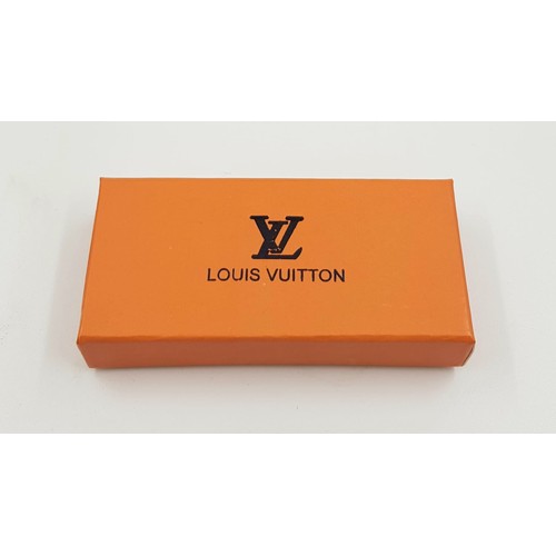 930 - A Louis Vuitton styled key holder - comes with box; as new.