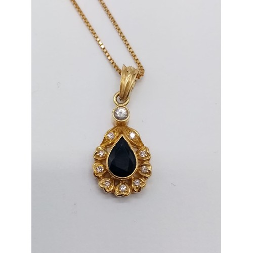 941 - Sapphire and diamond pendant set in 18ct gold on a 42cm long chain, weight 5g