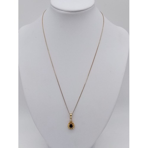 941 - Sapphire and diamond pendant set in 18ct gold on a 42cm long chain, weight 5g