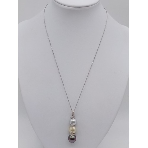 943 - South sea pearl pendant on 42cm long 18ct gold chain, weight 9.4g