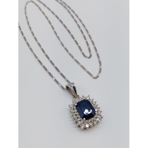 955 - Sapphire and diamond pendant on 49cm long 18ct gold chain, weight 6.5g