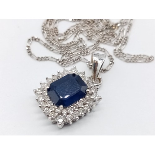 955 - Sapphire and diamond pendant on 49cm long 18ct gold chain, weight 6.5g