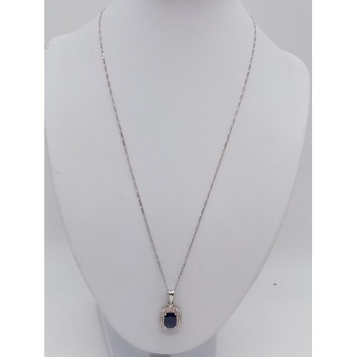 955 - Sapphire and diamond pendant on 49cm long 18ct gold chain, weight 6.5g