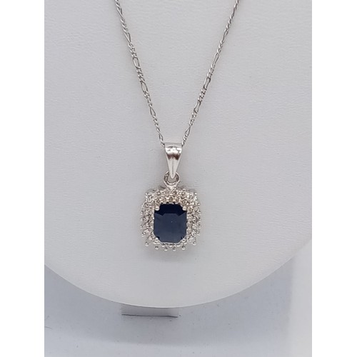 955 - Sapphire and diamond pendant on 49cm long 18ct gold chain, weight 6.5g