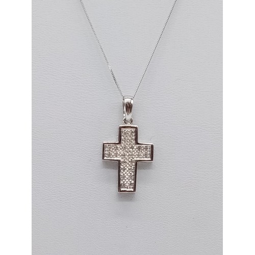 951 - 9ct white gold diamond cross pendant on 38cm chain, weight 2.6g