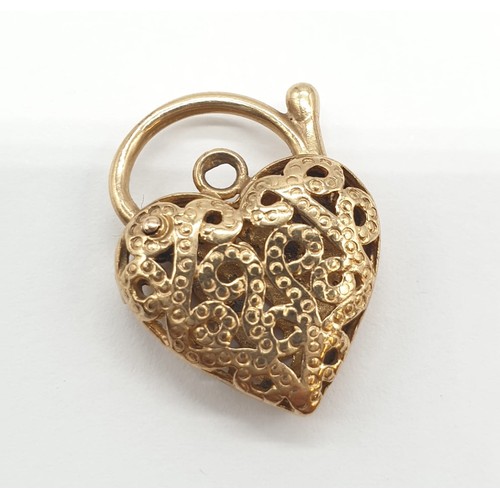 963 - 9ct heart padlock pendant. 2cm in length. 3.2g in weight.