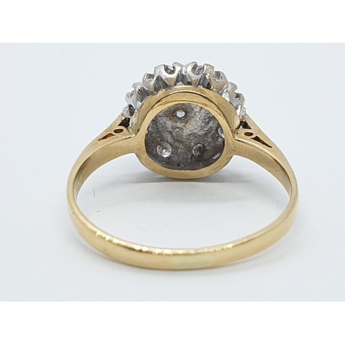 965 - 18ct gold diamond cluster ring. Size L. 3.1g in weight.