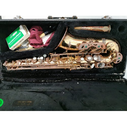 362 - A brass saxophone - the signature series. Original case in good working condition but needs cosmetic... 