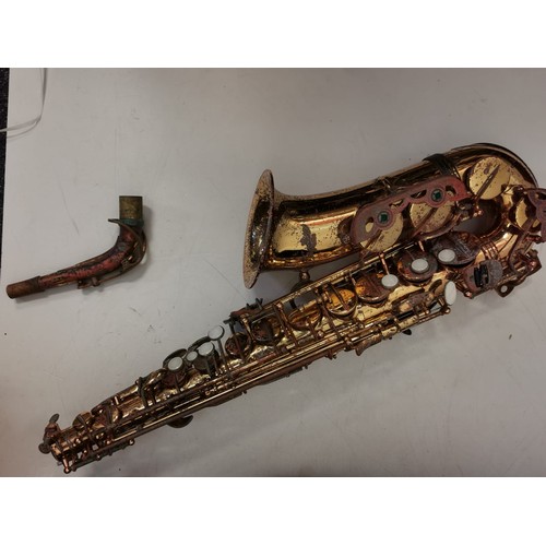 362 - A brass saxophone - the signature series. Original case in good working condition but needs cosmetic... 