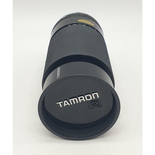 764 - A Tamron close focus 200mm lens. Good condition, 17cm long with case.