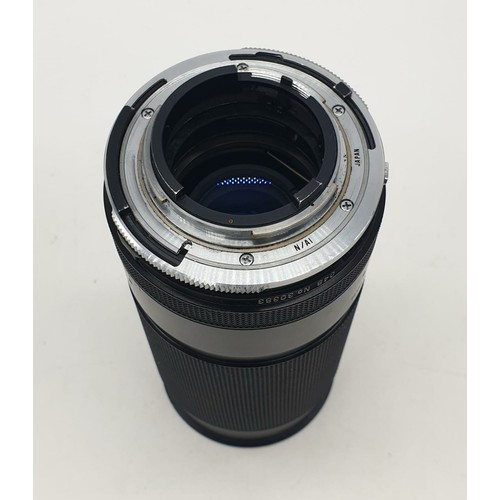 764 - A Tamron close focus 200mm lens. Good condition, 17cm long with case.