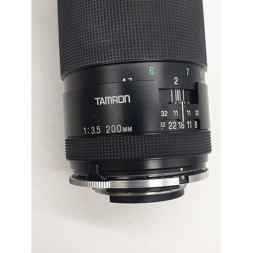 764 - A Tamron close focus 200mm lens. Good condition, 17cm long with case.