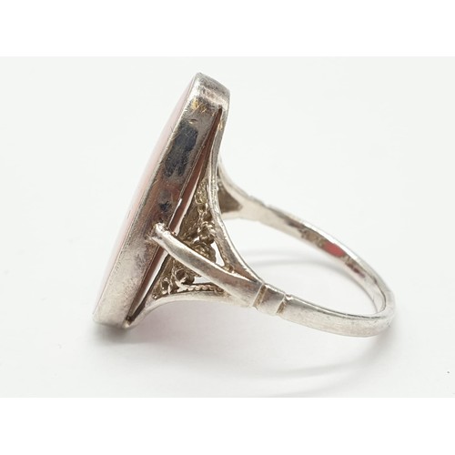 846 - Silver ring having large pink stone to top. Attractive Filigree work to shoulders. Size N1/2 .