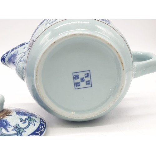 148 - A Chinese white porcelain with blue Paeonies tea set consisting of six cups and a lidded tea pot in ... 