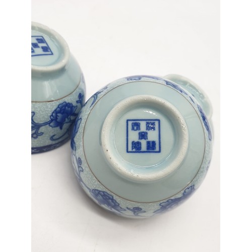 148 - A Chinese white porcelain with blue Paeonies tea set consisting of six cups and a lidded tea pot in ... 