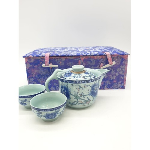 148 - A Chinese white porcelain with blue Paeonies tea set consisting of six cups and a lidded tea pot in ... 