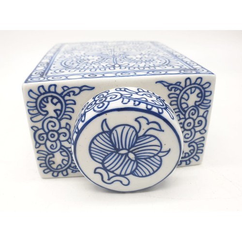 78 - A Japanese, white and blue hand painted, rectangular, porcelain, storage jar, with lid. Dimensions: ... 