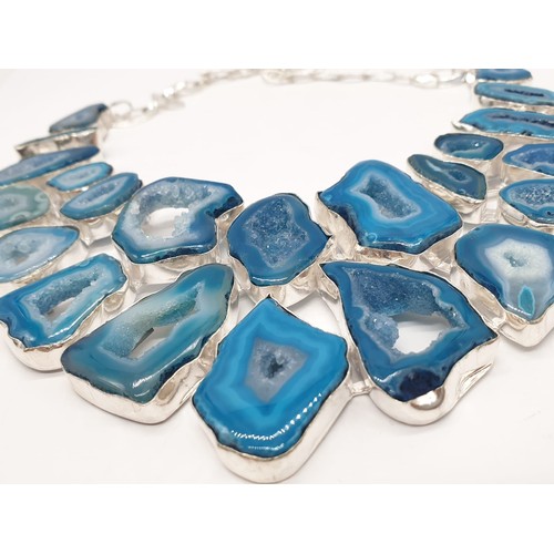 92 - A necklace, bracelet and ring set with blue agate from Botswana, in a presentation case. Necklace le... 