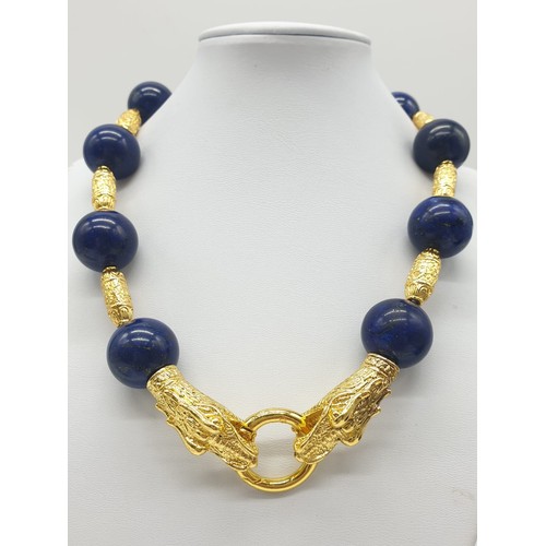 64 - An impressive set of lapis lazuli necklace and earrings, with large (20mm), round, lapis lazuli bead... 