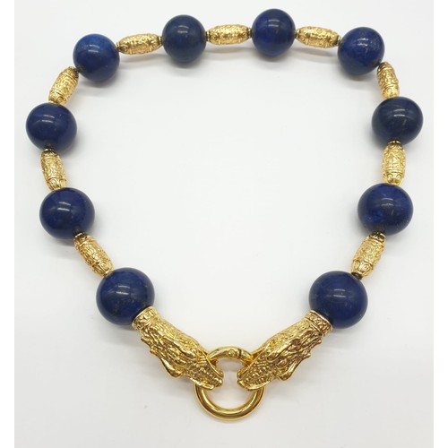 64 - An impressive set of lapis lazuli necklace and earrings, with large (20mm), round, lapis lazuli bead... 