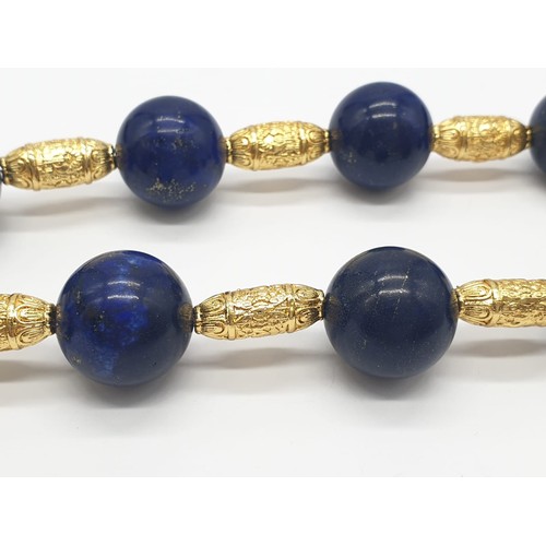 64 - An impressive set of lapis lazuli necklace and earrings, with large (20mm), round, lapis lazuli bead... 