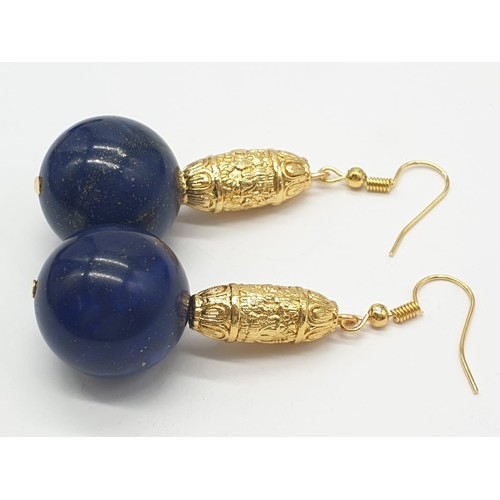 64 - An impressive set of lapis lazuli necklace and earrings, with large (20mm), round, lapis lazuli bead... 