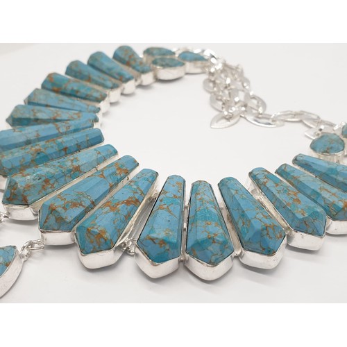 169 - A Pharaonic style necklace and earrings set with light brown-gold veined turquoise obelisks and face... 