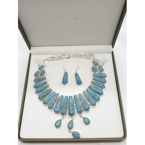 169 - A Pharaonic style necklace and earrings set with light brown-gold veined turquoise obelisks and face... 