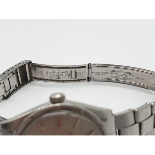 22 - A 70s gents stainless steel ROLEX watch.                                  The watch keeps time, but ... 