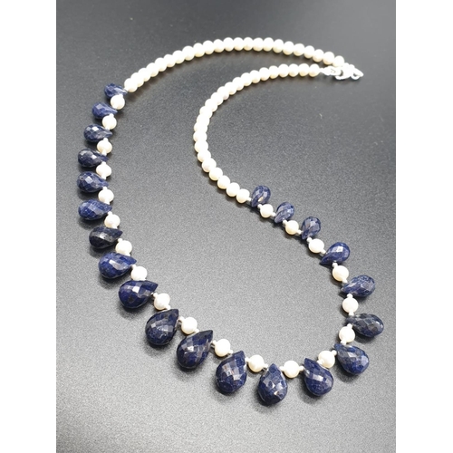 153 - Pearl Necklace with Blue sapphire drop earrings. Total weight 31.02 grams. Necklace length 22cm.