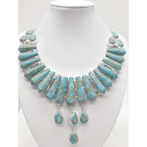 169 - A Pharaonic style necklace and earrings set with light brown-gold veined turquoise obelisks and face... 