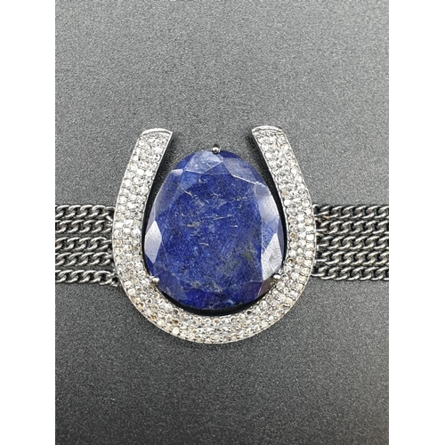 185 - 32.10 Cts Blue Sapphire inset a Horse shoe shaped bracelet. With 1.70 Cts Rose cut diamonds. Blacken... 