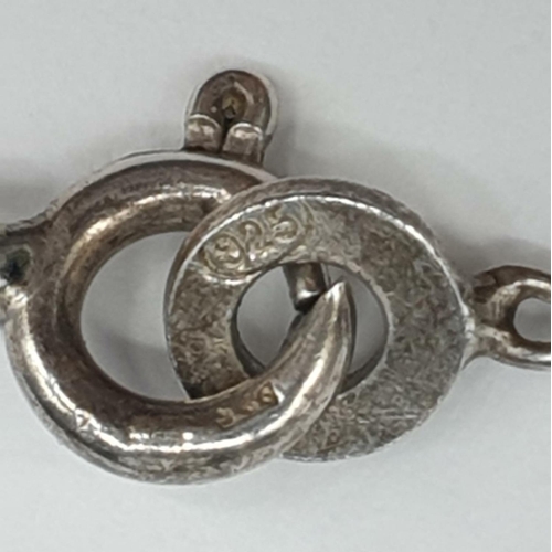 203 - Silver articulated fish pendant on silver chain. Hallmarked 1977. Length of pendant 6.5cm. Chain len... 