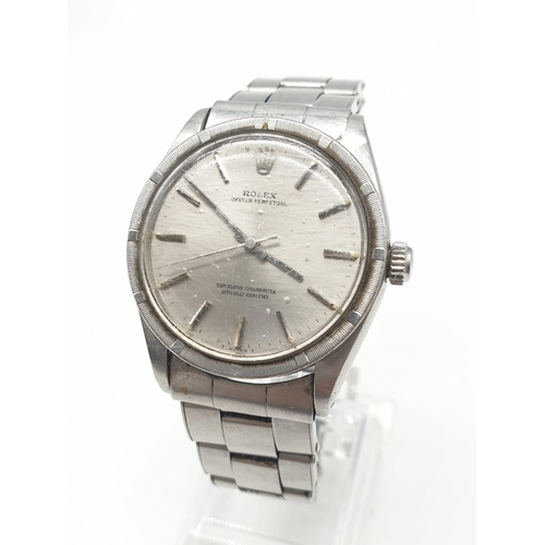 22 - A 70s gents stainless steel ROLEX watch.                                  The watch keeps time, but ... 