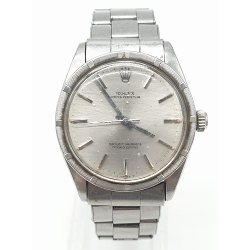 22 - A 70s gents stainless steel ROLEX watch.                                  The watch keeps time, but ... 