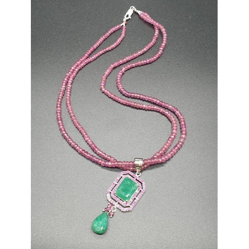 235 - Two Row Ruby necklace with Emerald Pendant with emerald Drop in sterling silver. Emerald weight in p... 