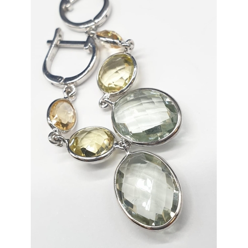 326 - Citrine and Green Amethyst Earrings in Sterling Silver. Weight 5.58 grams.