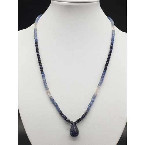 340 - A shaded Blue sapphire Necklace with a sapphire drop and matching dangler earrings. Necklace length ... 