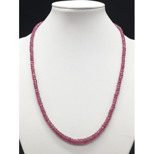 425 - A single row ruby necklace with sterling silver clasp. Length 22cm, weight 19.25 grams.