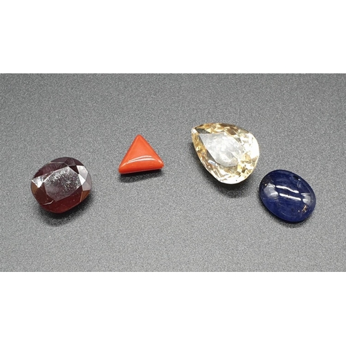 465 - A collection of 4 gemstones 11.27cts Garnet Gemstone,3.77 triangular coral, 10.32cts Cabochon Blue s... 