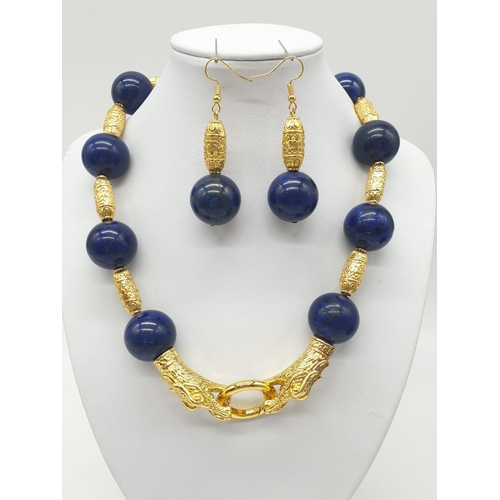 64 - An impressive set of lapis lazuli necklace and earrings, with large (20mm), round, lapis lazuli bead... 