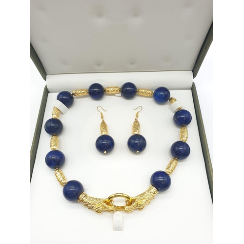 64 - An impressive set of lapis lazuli necklace and earrings, with large (20mm), round, lapis lazuli bead... 