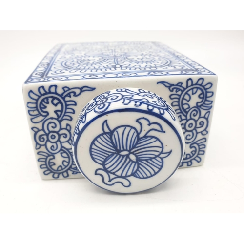 78 - A Japanese, white and blue hand painted, rectangular, porcelain, storage jar, with lid. Dimensions: ... 