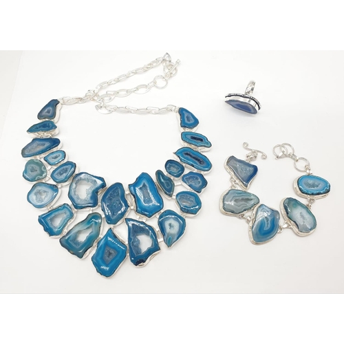 92 - A necklace, bracelet and ring set with blue agate from Botswana, in a presentation case. Necklace le... 