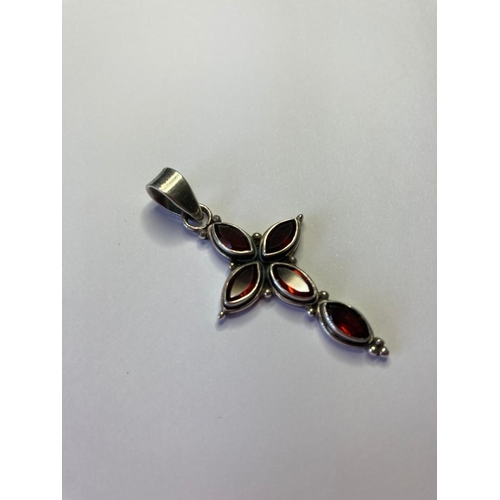 374 - Silver stone set pendant cross with five garnet coloured gemstones. 925 silver. 4.8cm drop approx.