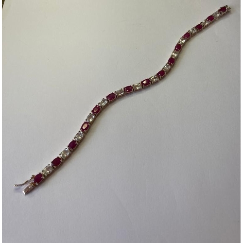 385 - Silver tennis bracelet with pale aqua and pink spinel stones set in four claw mounts. 925 silver. 7.... 