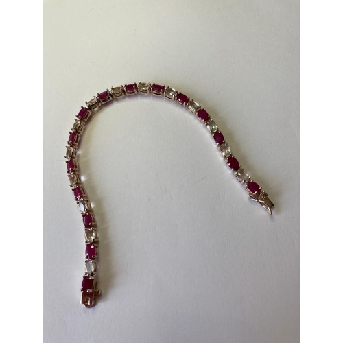 385 - Silver tennis bracelet with pale aqua and pink spinel stones set in four claw mounts. 925 silver. 7.... 