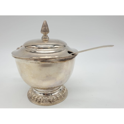 129 - Asprey  London Silver Condiment pot and spoon, weight 197g and 9cm tall approx