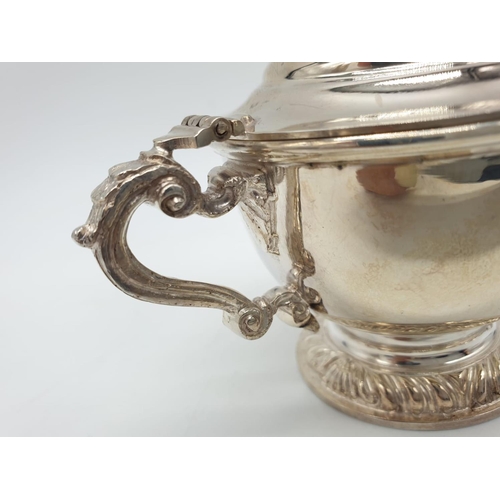 129 - Asprey  London Silver Condiment pot and spoon, weight 197g and 9cm tall approx